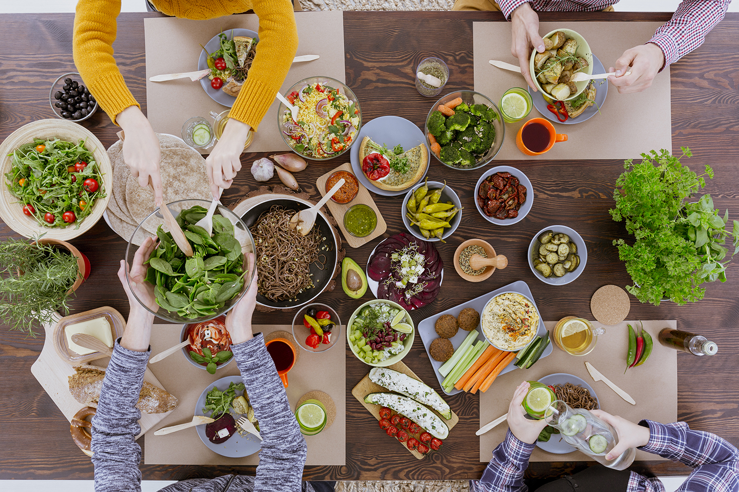 Various vegetarian food lying on rustic wooden table